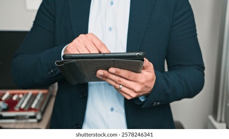 Professional Man Using a Digital Tablet in a Modern Business Environment