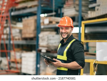 Professional manager man employee using tablet check stock working at warehouse. Worker wearing high visibility clothing and a hard hat, helmet and checking and count up goods or boxes for delivery. - Powered by Shutterstock