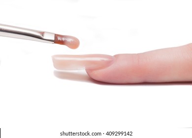 Professional Manicurist Applying Liquid Acrylic To Nail Extensions. Macro

