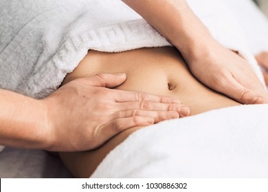 Professional massage of the abdomen. - Powered by Shutterstock