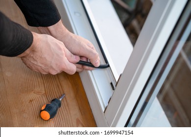 Professional master at repair and installation of windows, changes rubber seal gasket in pvc windows.