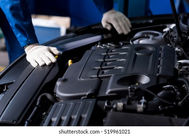 Professional Mechanic Checking Car Engine