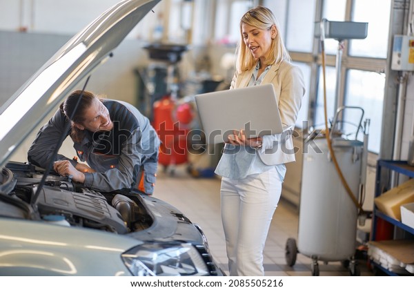 Professional mechanic store doing car diagostic\
for repair
