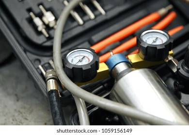 Professional Mechanic Testing Diesel Injector In His Workshop.