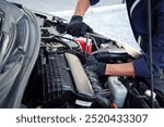 Professional mechanic working on the engine , repairing a car engine automotive workshop with a wrench, car service and maintenance,Repair service.