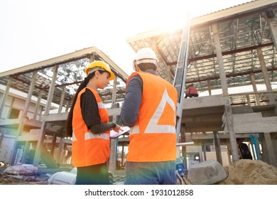 Professional Mechanical Engineer Team Working On Construction Site.  Home Building Project Quality Inspection