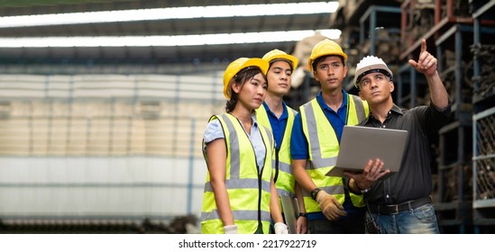 Professional Mechanical Engineer Team Working On Personal Computer At Second-hand Spare Parts Of Old Car Parts Warehouse Store. 