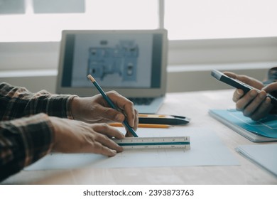 Professional Mechanical Engineer team Working on Personal Computer at Metal lathe industrial manufacturing factory. Engineer Operating lathe Machinery. Product quality Inspection - Powered by Shutterstock