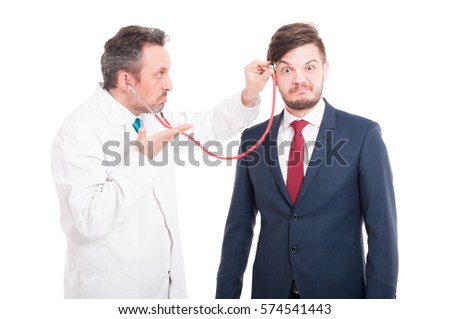 Professional medic cheking  head of insane lawyer for brain problems isolated on white background