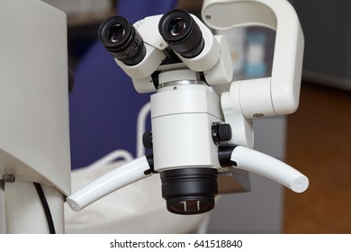 Professional medical dental binocular microscope in the dentist's office.