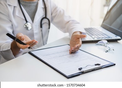 Professional medical doctor consulting and inquired about patient's history at hospital and report the health examination results, Health care concept 