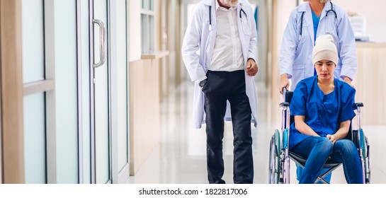 Professional Medical Doctor Team With Stethoscope In Uniform Discussing With Patient Woman With Cancer Cover Head With Headscarf Of Chemotherapy Cancer In Hospital.health Care Concept