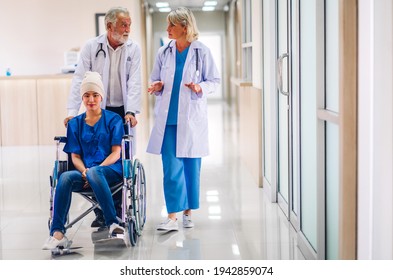 Professional Medical Doctor Team With Stethoscope In Uniform Discussing With Patient Woman With Cancer Cover Head With Headscarf Of Chemotherapy Cancer In Hospital.health Care Concept