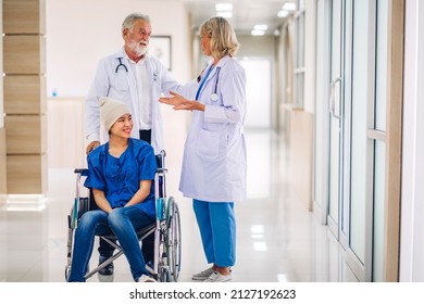 Professional Medical Doctor Team With Stethoscope In Uniform Discussing With Patient Woman With Cancer Cover Head With Headscarf Of Chemotherapy Cancer In Hospital.health Care Concept