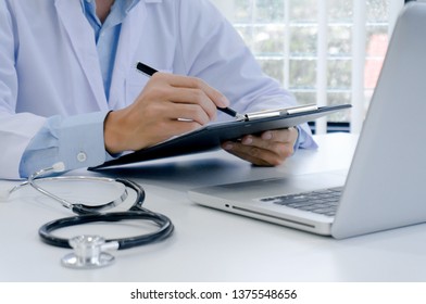 Professional Medical Doctor In White Uniform Gown Coat Interview Consulting Patient