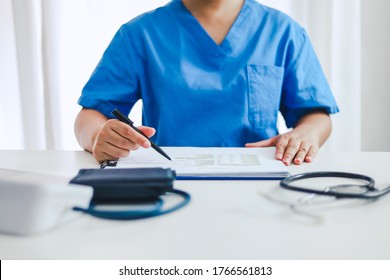 Professional Medical Doctor In White Uniform Gown Coat Interview Consulting Patient