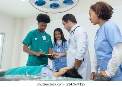 Professional Medical Teacher Give Tuition Group Students In Patient Operating Room.