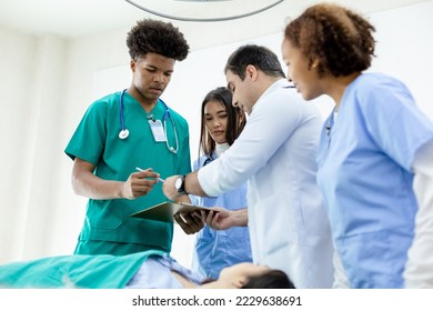 professional medical teacher give tuition group students in patient operating room. - Powered by Shutterstock