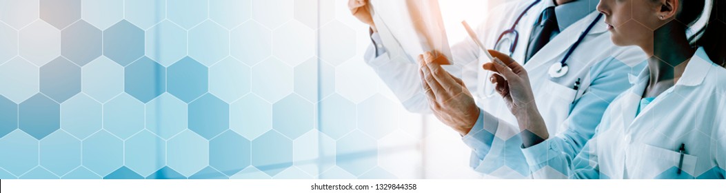 Professional medical team examining a patient's radiography, healthcare and prevention concept, banner with copy space - Powered by Shutterstock