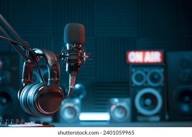 Professional microphone and headphones at the radio station, entertainment and communication concept