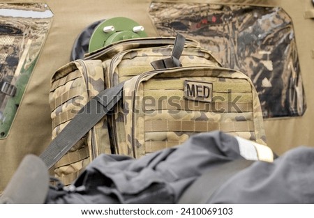 A professional military grade medkit, infantry army med kit, bag of medical supplies and equipment green camo bag closeup, nobody. War, warzone medics, help for the injured soldiers simple concept Zdjęcia stock © 