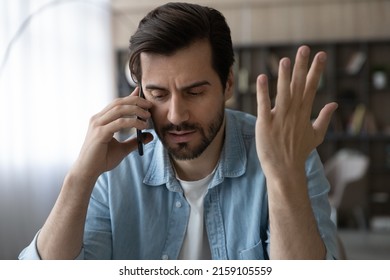 Professional misfortune. Troubled casual businessman call boss partner discuss business failure ask for advice in difficult situation. Unhappy young male share personal problems with friend by phone