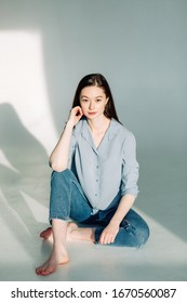 Professional model and pose at the cyclorama. Model tests of a girl in a Studio with a white background. 