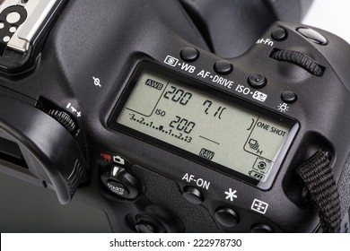 Professional Modern DSLR Camera - Detail Of The Top LCD With Settings - Shutter Speer, Aperture, ISO, AF Mode, Battery Info, RAW Format Indication,...