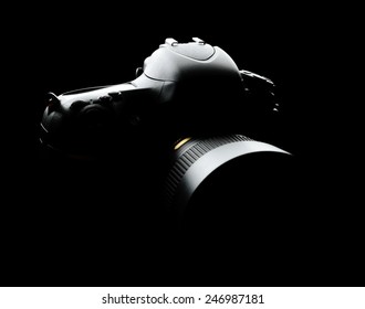Professional Modern Full-Frame DSLR Camera with Lens on the Black Background