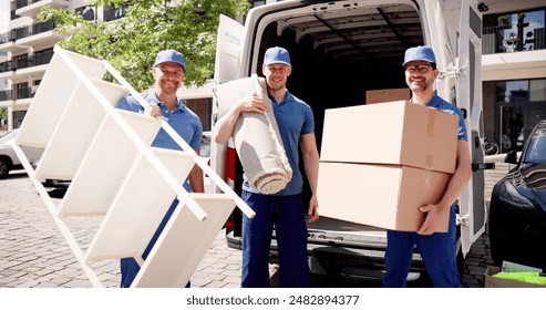 Professional movers working efficiently as they transport carpet and furniture for warehouse delivery, unloading inventory from van for office removal. - Powered by Shutterstock