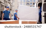 Professional Moving Services: Young Movers Transport Mattress for Delivery in Proud Workers Uniform on Company