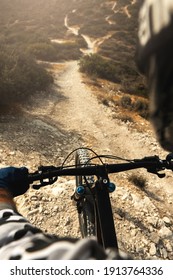 Professional MTB bike rider during downhill ride on his bicycle in mountains