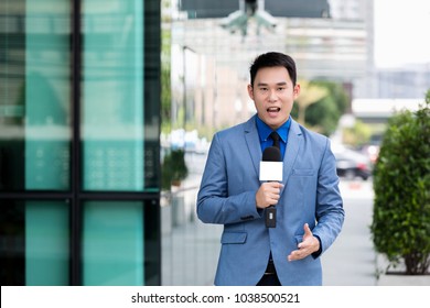 Professional News Reporter Live Broadcasting On Urban Street