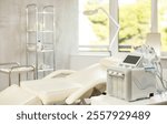 Professional office of aesthetic medicine clinic with treatment chair for patients and modern hydrogen oxygen beauty machine with different attachments to provide specialized skincare procedures