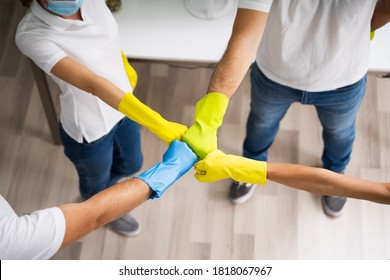 Professional Office Cleaning Janitor Team Spirit And Huddle With Face Masks - Powered by Shutterstock