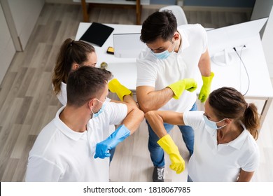 Professional Office Cleaning Janitor Team Spirit And Huddle With Face Masks