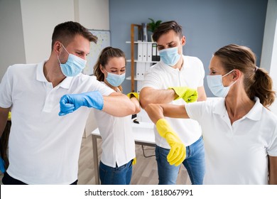 Professional Office Cleaning Janitor Team Spirit And Huddle With Face Masks