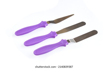 Professional Offset Spatula Set For Icing Large Cakes Quickly. Starter Kit For Decorating A Cake. Confectioner's Tools Isolate On White . Pastry Spatulas. High Quality Photo