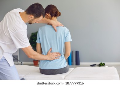 Professional Osteopath Or Chiropractor Fixing Woman Patients Back Muscles During Rehabilitation Theapy For Backpain Relief In Manual Therapy Clinic. Chiropractor During Work Concept