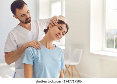 Professional osteopath during work fixing womans neck - Powered by Shutterstock