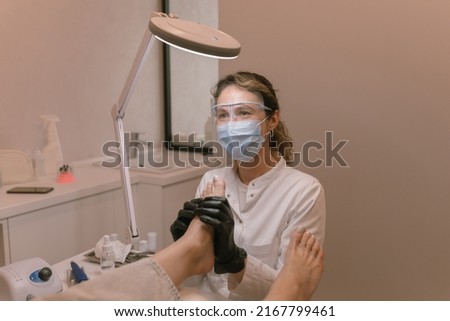 Professional pedicure specialist, chiropodist at work. Podiatry doctor. Treatment of feet and nails. Zdjęcia stock © 