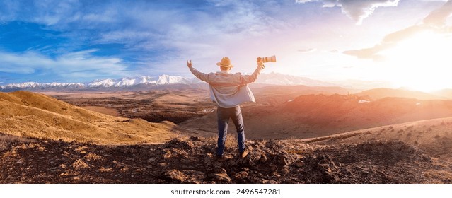 Professional photographer man with camera taking photo of Altai mountains and river, back view sunset light. Concept banner travel and hobby hike. - Powered by Shutterstock