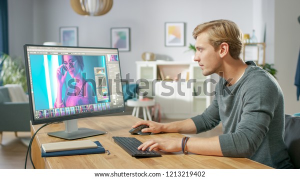 Professional Photographer Works in Photo\
Editing App / Software on His Personal Computer. Photo Editor\
Retouching Photos of Beautiful Girl. Mock-up Software\
Design.
