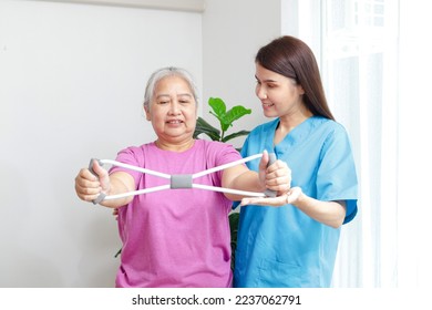 professional physical therapist Helping physical therapy for elderly female patients Exercise your wrists and strengthen your muscles. physical therapy center for rehabilitation of elderly patients - Powered by Shutterstock