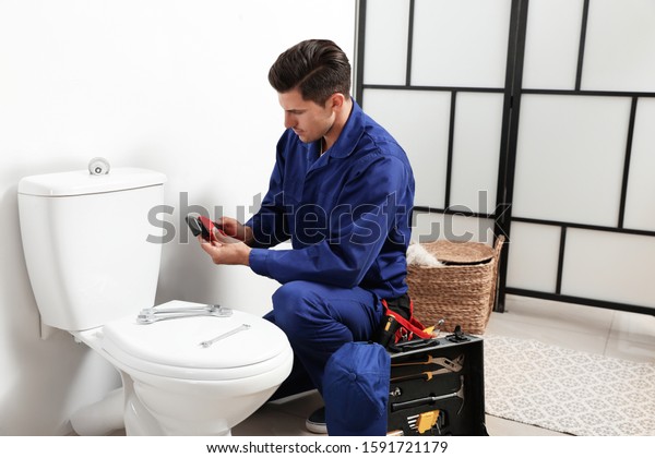 6,303 Plumber Fixing Toilet Images, Stock Photos & Vectors | Shutterstock