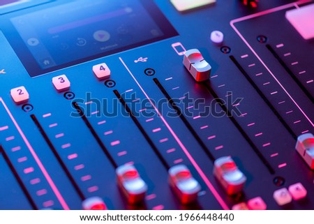 Professional podcast mixing console with faders and adjusting buttons, Audio sound mixer console. Sound mixing desk. Music mixer control panel in recording studio. podca mixer control  broadcasting