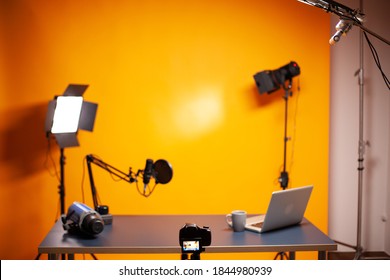Professional podcast and vlogging setup in studio with yellow background. - Shutterstock ID 1844980939