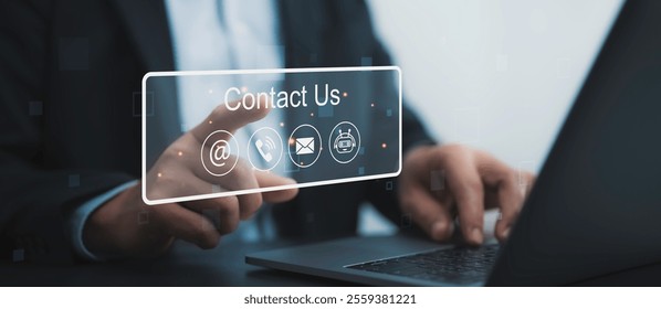 Professional points to a glowing "Contact Us" interface with email, phone, and chat icons. A futuristic concept for customer support, communication, and business networking - Powered by Shutterstock