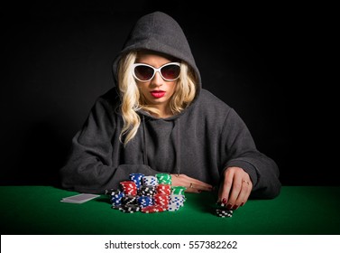 Professional Poker Player With Glasses Making Poker Face