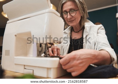 Similar – Image, Stock Photo Girl stiring coffee and looking her tablet